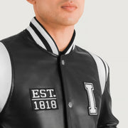 Close-Up Detail of Varsity &amp; Snap Button Hardware on Liberte Illinois Black Leather Varsity Jacket